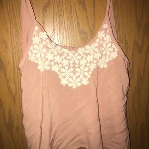 Pink tank top with white flower details